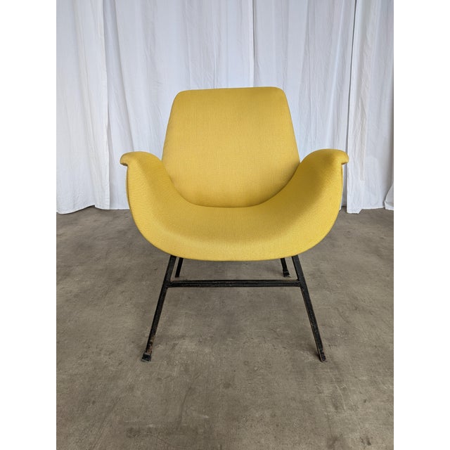 Vintage cocktail armchair in the style of Alvin Lustig, made in the 1960s. The chair features elegant mid-century lines, a...