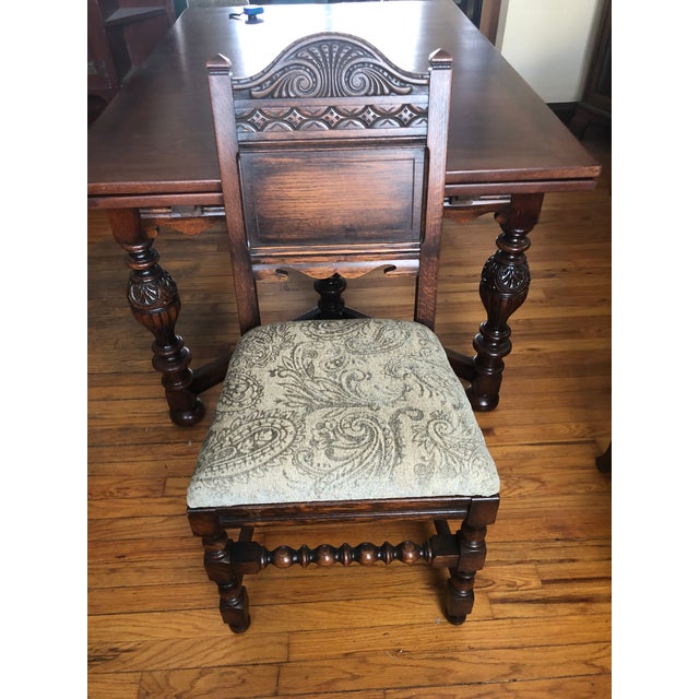 Early 20th Century Jacobean Style Carved Oak Dining Room Set with