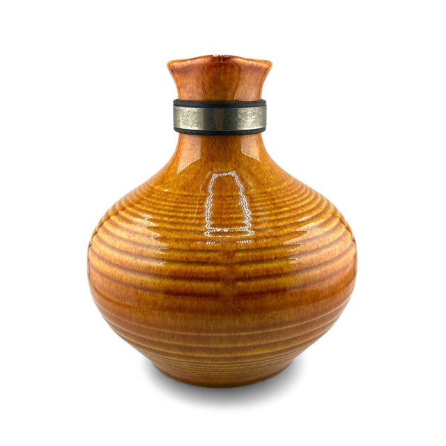 Stunning in orange! No chips or cracks- has a few minor firing nicks on the bottom. Wooden handle has a lot of varnish...