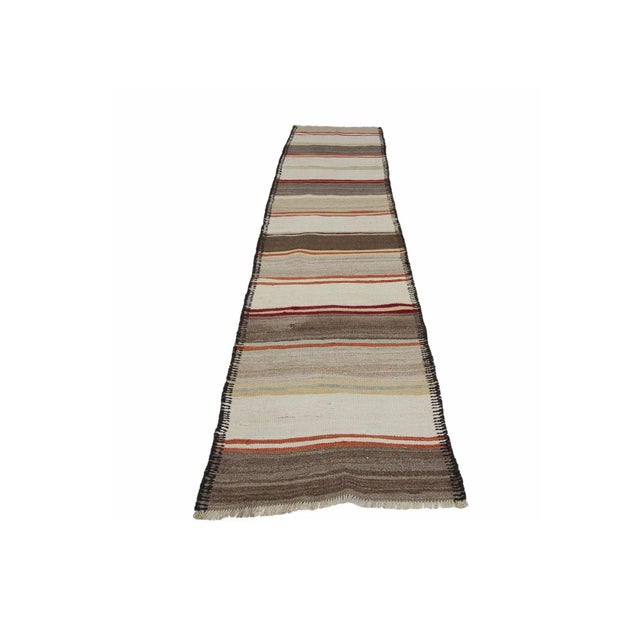 Vintage decorative handwoven kilim runner from South Eastern Turkey.Approximately 45-55 years old. In very good condition.