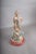 Art Deco revival sculpture depicting a poised woman in a draped gown beside a Borzoi dog. Both figures are silver-plated...