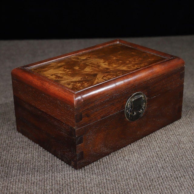 A beautifully crafted Chinese hardwood box, likely made of Huali (rosewood), featuring a striking burl wood (burr wood)...
