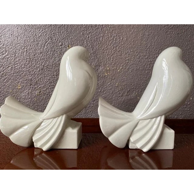 Magnificent and pair of ceramic birds. Doves or pigeons signed by Jacques Adnet. In good condition, chips to report on the...