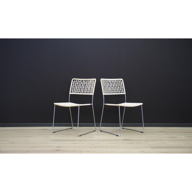 The set of two chairs made in the 1960s, Scandinavian production. The structure is made of metal, the back and seat made...