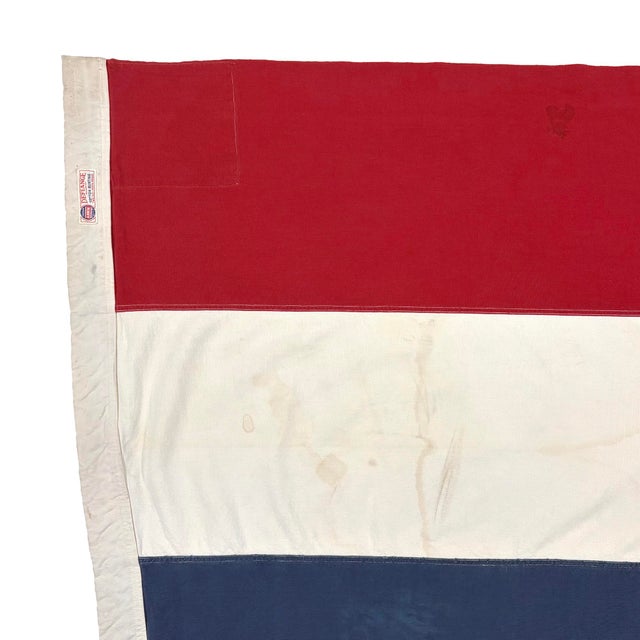 This large vintage Thai flag is made from a cotton cloth, with sewn stripes and printed elephant visible on both sides....