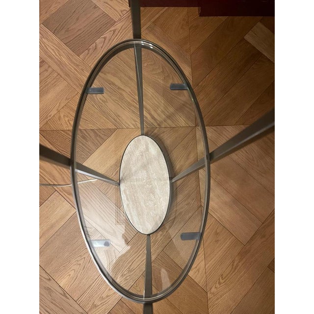 A refined pair of architectural floor lamps in deep patinated bronze, featuring a slender open-frame structure with...