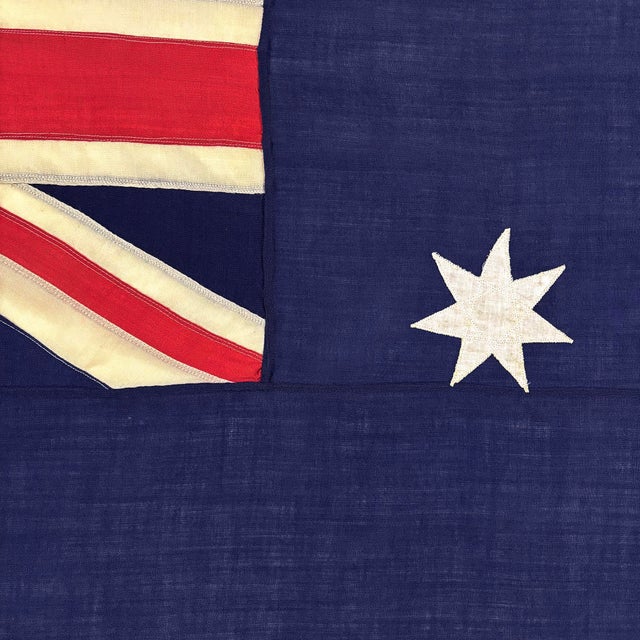 This vintage Australian flag is made from a wool cloth, with fully sewn Union Jack and stars. Please note minor holes,...