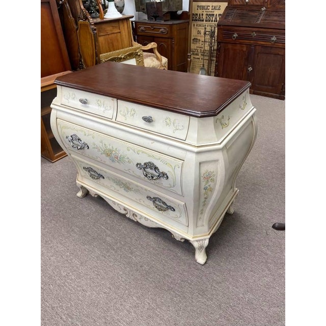 Up for sale is a Bombay style dresser loaded with beautiful details. The dresser is all white, but has a finished wood...