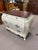 Up for sale is a Bombay style dresser loaded with beautiful details. The dresser is all white, but has a finished wood...
