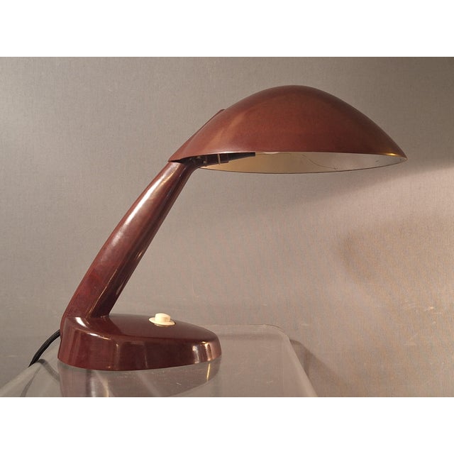 Bakelite lamp with glass base by LBL. Often attributed to Marianne Brandt; however, this is not documented. Exceptional,...