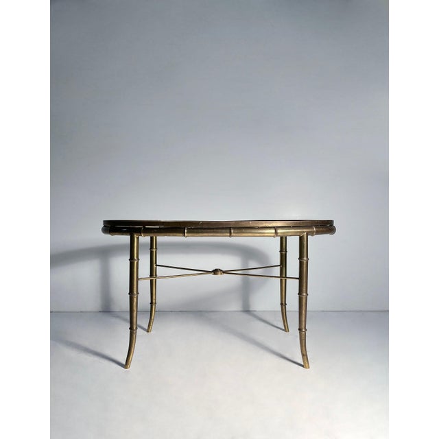 Mastercraft Faux Bamboo Brass Oval End Tables Comes with Glass tops (not shown). Please inquire for condition report.