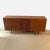 This dresser features a classic mid-century modern style with a warm wood finish. It has six spacious drawers and a center...