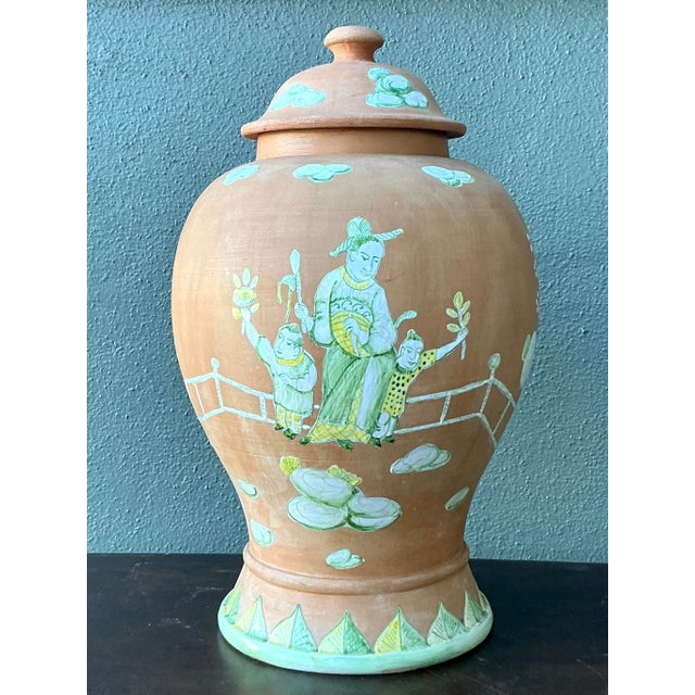 This exquisite vintage lidded urn is a masterclass in Chinoiserie design, blending traditional Asian motifs with a refined...