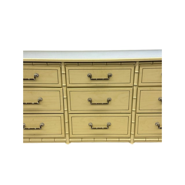 This vintage Henry Link faux bamboo 9-drawer dresser is a stunning example of classic Palm Beach Regency style, adding a...