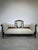 Elegant Edwardian period settee crafted in richly figured mahogany with exquisite satinwood and boxwood inlay decoration....