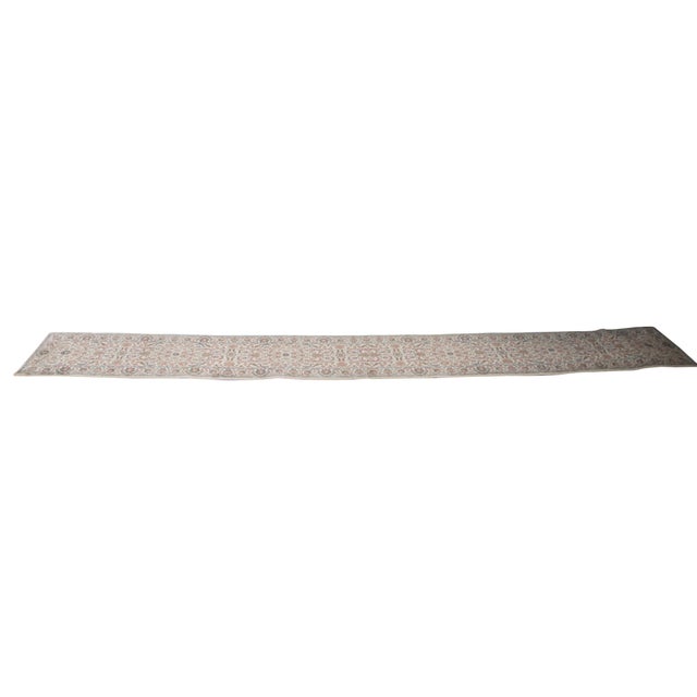 Very long vintage Karastan 100% wool area rug / mat / carpet featuring a floral motif inspired by palmettes and scrolled...