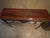 Elegant Luigi XVI and stately wooden console table featuring beautiful neoclassical details and an exquiite inlaid top....