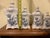 A charming and exceptionally decorative 11-piece vintage T. Delfts Bleau graduated kitchen canister collection, dating to...