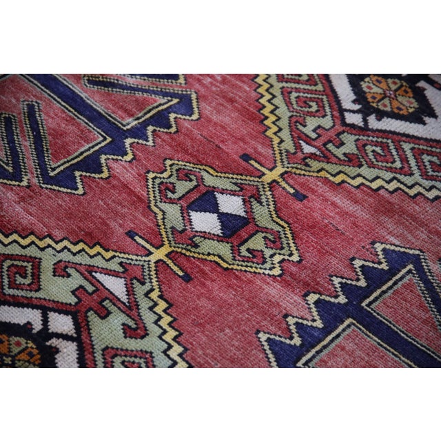 Introducing a one-of-a-kind vintage Turkish hand-knotted wool rug, carefully crafted by skilled artisans using traditional...