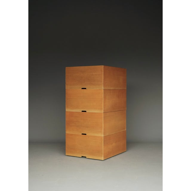 A set of four solid beech wood storage boxes that were designed by the Dutch mid-century architect Wim den Boon. They were...