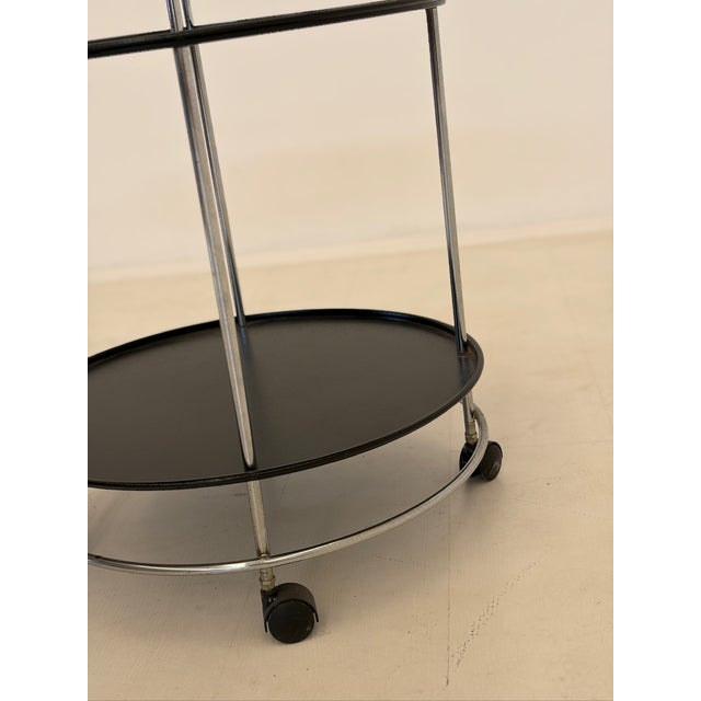 Simple and elegant trolley, produced by Norda, late 1980s. Made with a wooden frame and two forest green plastic shelves;...