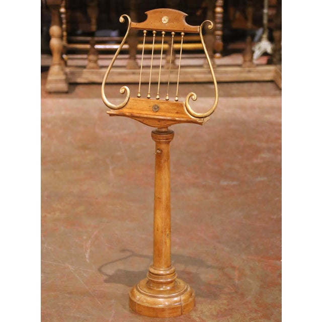 Crafted in France circa 1870, this elegant antique music stand, or lutrin, is built of solid walnut and designed in the...
