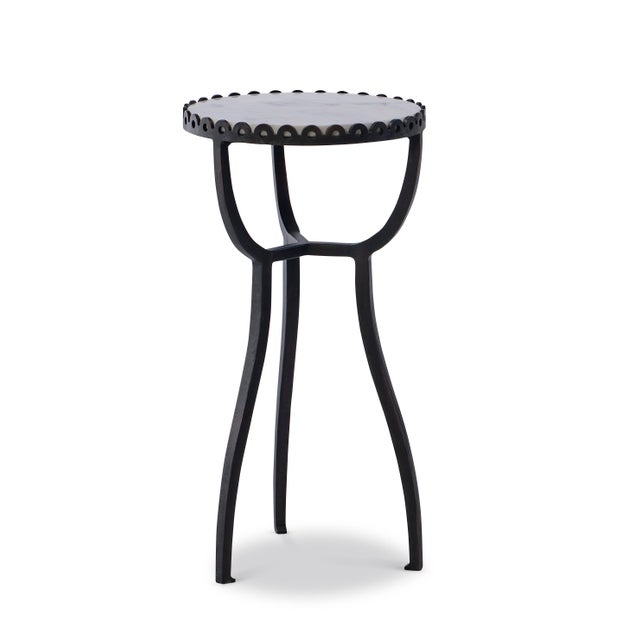 The Bjork Side Table pairs a slender, sculptural iron base with the quiet elegance of a Banswara marble top, prized for...