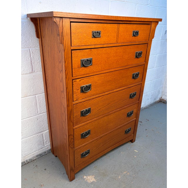 A beautifully crafted Mission-style highboy dresser by Vaughan-Bassett, made from solid oak with classic vertical slat...