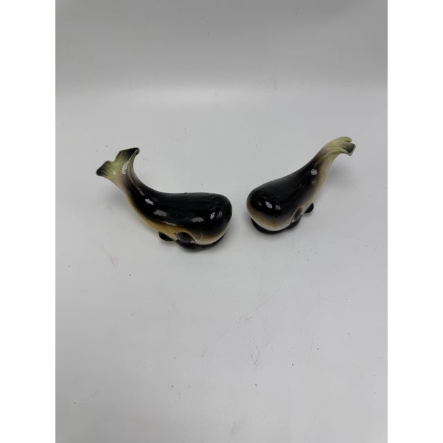 Charming vintage whale-shaped ceramic salt and pepper shakers featuring a glossy hand-painted finish in soft shades of...