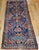 "Vintage Persian Kurdish tribal area rug or a wide runner, meticulously hand-knotted circa the early 1900s. Originating...