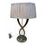 Elegant Italian table lamp from the 1950s, defined by its sculptural brass base composed of two curved arms that...
