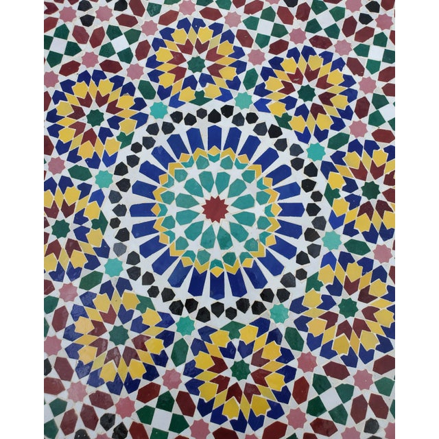 Multicolor custom-made Moroccan mosaic table measuring 40" in diameter. An indoor / outdoor dining table that sits up to...