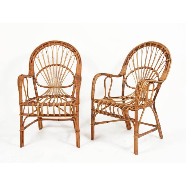Gorgeous pair of mid-century armchairs entirely made of bamboo, curved rattan and hand-woven wicker. These charming...