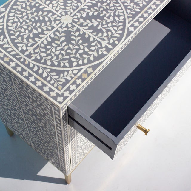 The Arabesque Bone Inlay Four-Door Buffet presents classical botanical ornamentation through an intricate composition of...