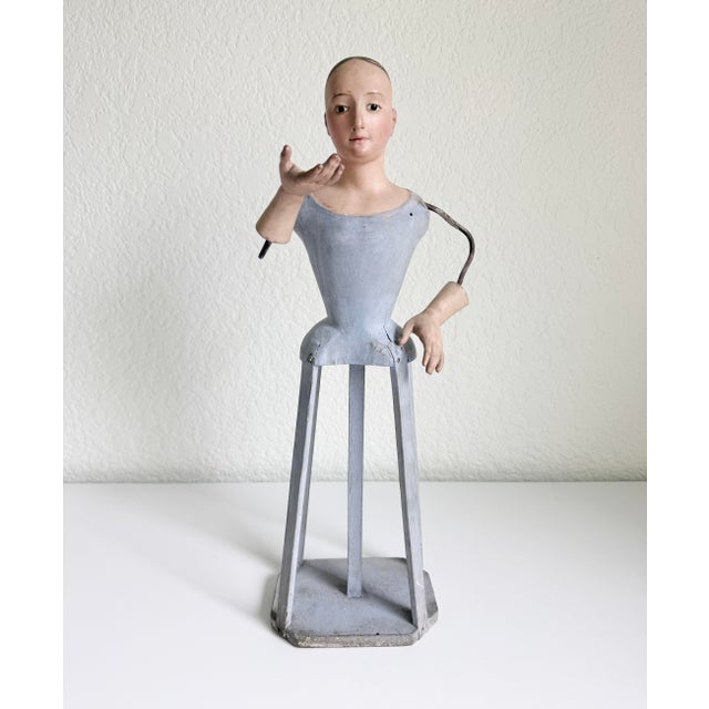 An early religious cage doll figure with warm gaze and a soft smile. French origin, mid to late 18th century. Crazing and...