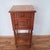 Charming french bedside table from around 1900 with a decorative marble top and elegant fluted legs. Designed in the...