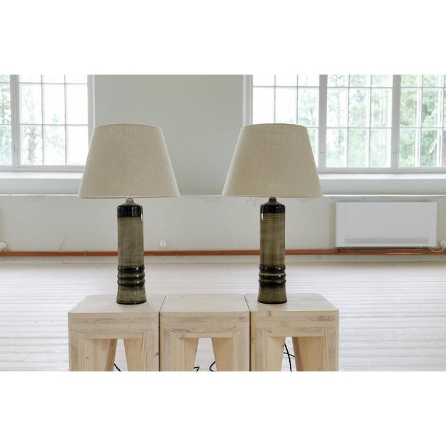 Large earthy toned glazed stoneware pair of table lamp by Olle Alberius for Rörstrand, Sweden, 1970s. Signed on the base....