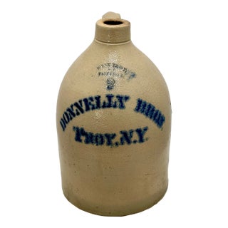 Antique American Blue Decorated 2 Gallon Stoneware Advertising Jug by West Troy Pottery Co. New York Circa 1880s For Sale