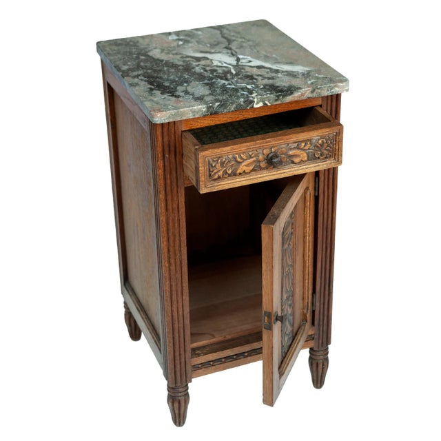A Beautiful Vintage Deco Wood & Marble Topped Side Table with a Drawer & Door. Inset handcarved Floral motif. The Marble...
