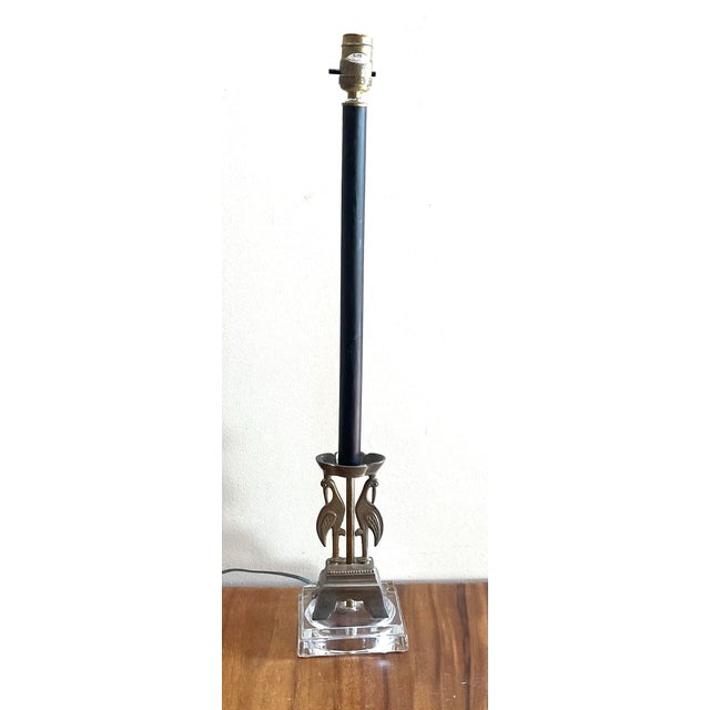 This unique item is an Empire-style bronze and glass table lamp, which frequently draws from late 19th or early 20th-...
