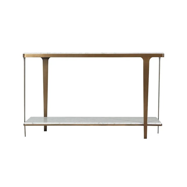 An Art Deco style marble top console with a brushed brass finish steel base with tapered legs and a marble top shelf...