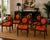 Striking set of six dining armchairs by Minton-Spidell, blending neoclassical elegance with bold Hollywood Regency flair....