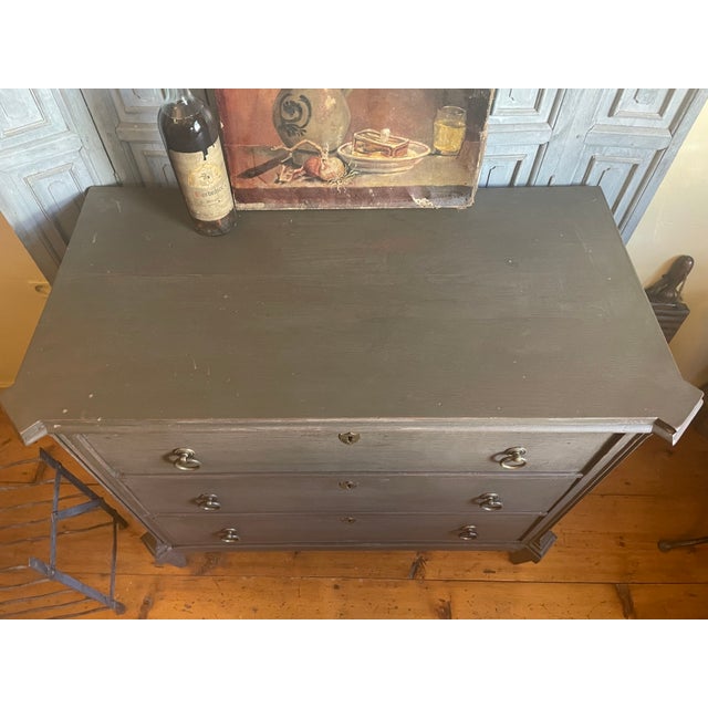 A magnificent 19th-century chest of drawers in Louis Seize style from our own country. The cabinet has 3 large drawers...