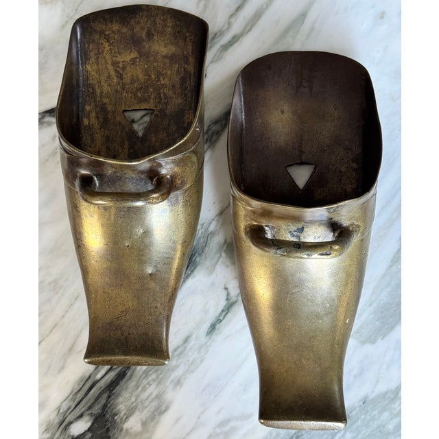 Sourced in Southern California, here is a pair of antique Spanish Revival Conquistador Solid Brass Stirrups. A unique...