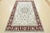 A traditional Nain rug hand-knotted with an all-wool pile on a cotton foundation. This finely woven oriental rug features...