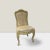 A set of 8 elegant Louis XIV style chairs. Carved frames in a creamy ivory distressed finish and cabriole legs....