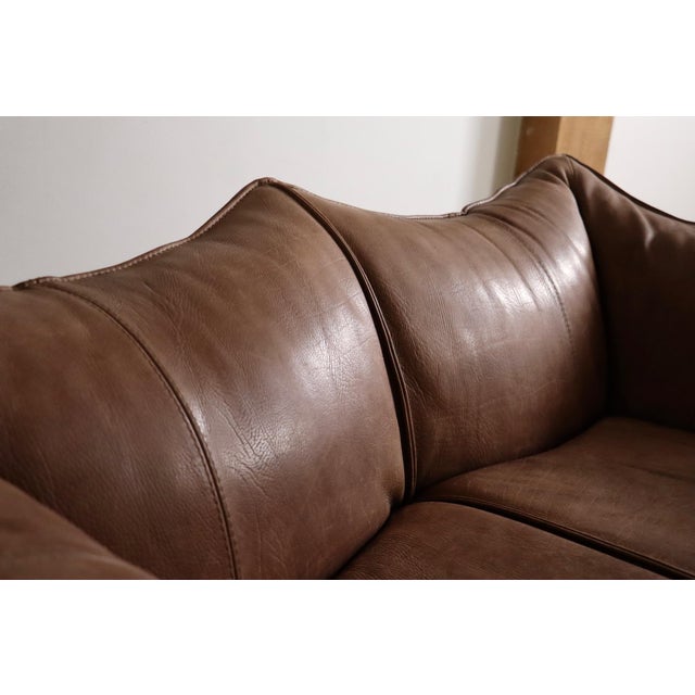 Beautiful le bambole sofa in original light brown buffalo neck leather designed by mario bellini for b&b italia in the...
