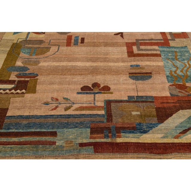 This stunning vintage wool rug, intricately hand-knotted in the Arts & Crafts style, features a warm brown color field...