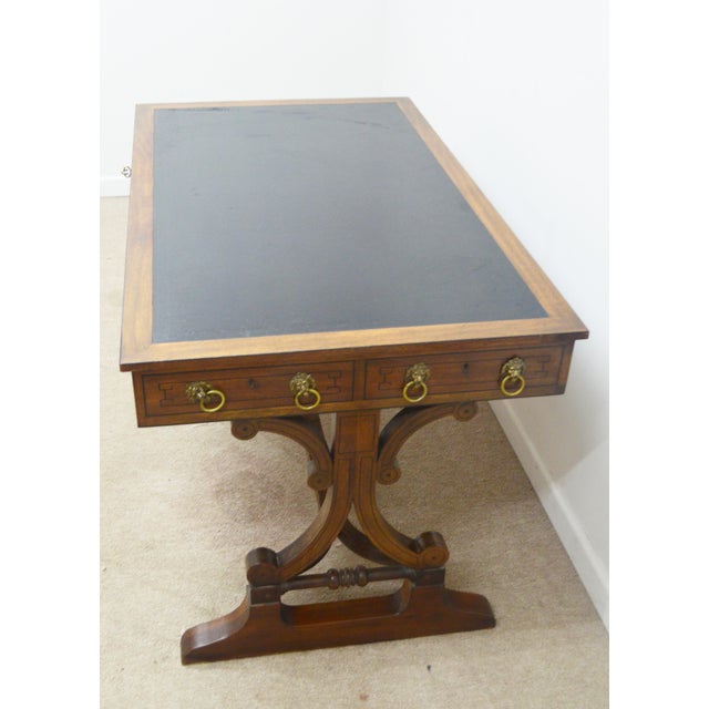 Writing Desk by Baker. Store item #443. It features two dovetailed drawers, leather top and finished back.