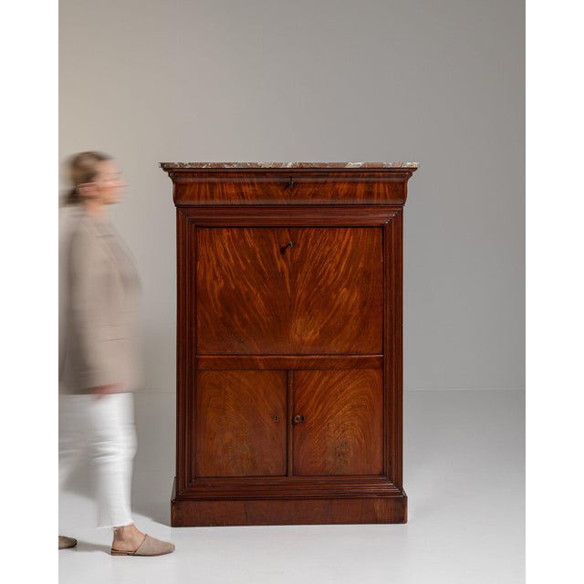 Mahogany secretaire abattant in Rich Mahogany. Its rich mahogany finish sets off fall-front writing surface, inset marble...